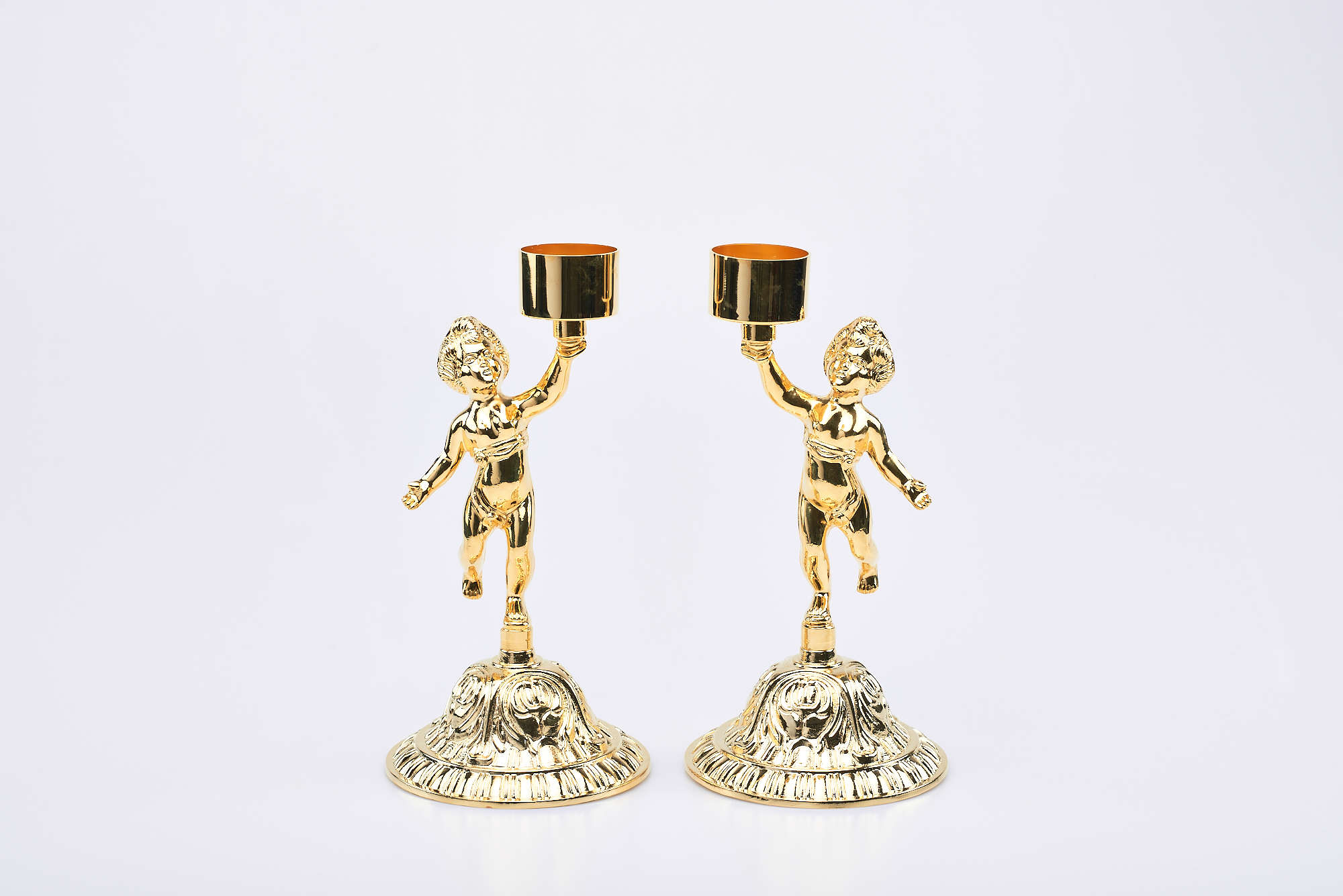 Coppia candelieri con fusione putti